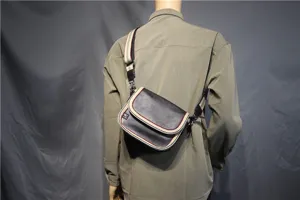 Casual men's crossbody shoulder bag with stylish striped strap and flap closure design.