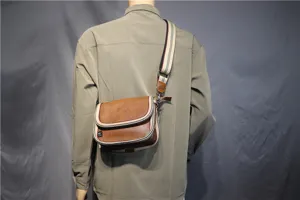Men's casual crossbody shoulder bag with striped strap, brown leather look design stylish.