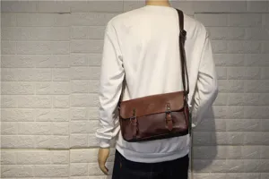 Detailed view of brown retro leather messenger bag with double buckle flap for men daily use.