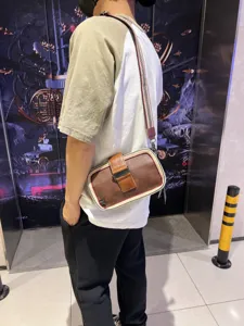 Vintage mens crossbody shoulder bag with stripe and buckle, casual fashion bag for men.