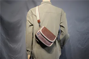 Men's casual brown crossbody saddle bag with stylish striped strap, detailed back view.