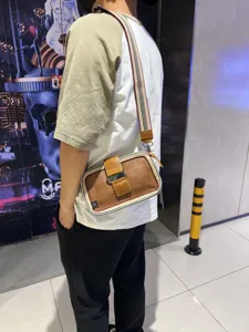 Retro striped crossbody shoulder bag for men and women, stylish outdoor phone bag with buckle.