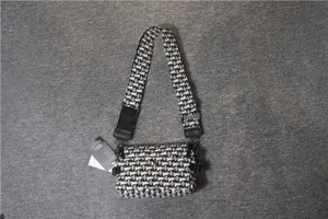 Sac bandoulière en toile pour hommes et femmes, sac croisé à motif géométrique noir et blanc.