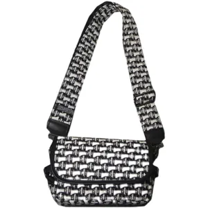Sac bandoulière en toile géométrique noir et blanc avec large sangle et rabat.