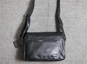 Close-up detail of the black PU leather men messenger bag featuring a zipper pocket and strap.