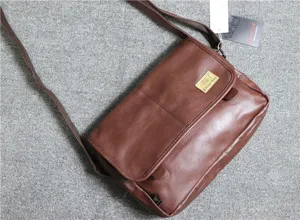 Brown PU leather messenger bag detail showing soft texture, flap closure and adjustable strap.