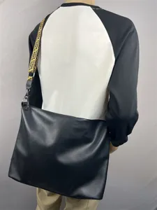 Men black large capacity messenger bag with stylish geometric strap for travel daily use.