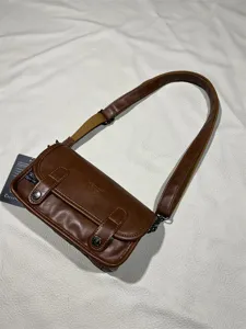 Vintage brown leather crossbody bag for men and women, casual streetwear shoulder bag with pockets.