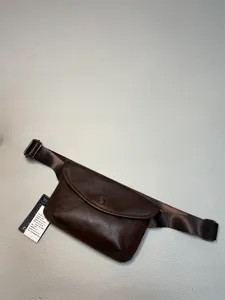 Detailed view of dark brown leather fanny pack, vintage casual crossbody chest bag design.