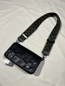 Retro black PU leather crossbody bag with wide geometric strap, perfect for casual daily streetwear.