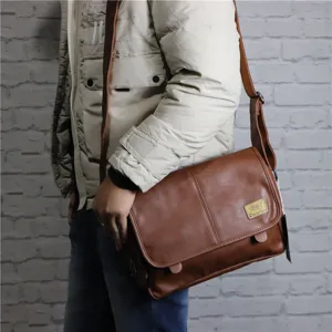 Vintage brown leather messenger bag for men, stylish crossbody shoulder bag for daily use.