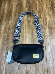 Detailed view of the black PU casual shoulder bag with wide patterned strap and hardware.