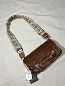 Vintage brown messenger bag for men and women, retro casual canvas strap shoulder bag.