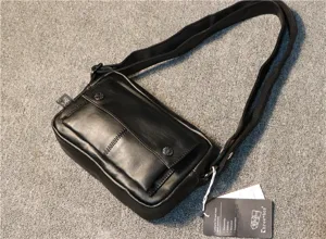 Black leather mens crossbody bag detail, casual single shoulder mini messenger bag with tag.