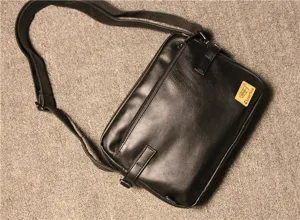 Black leather messenger bag for men, casual retro shoulder bag with zipper pocket.