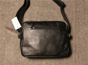 Detail view of men's vintage shoulder bag showing adjustable strap and zipper pocket.