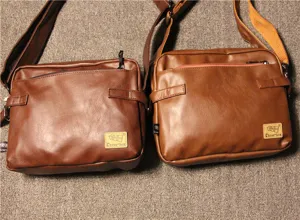 Detailed view of men's vintage PU leather shoulder bag, casual crossbody messenger style.