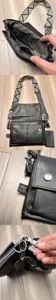 Black leather crossbody bag detail view, showing durable hardware and adjustable strap.