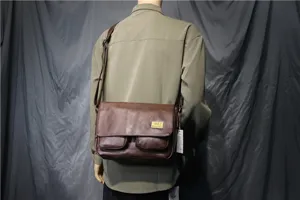 Brown vintage PU leather messenger bag detail showing flap design and double front pockets.