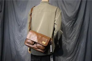 Threebox retro brown leather messenger bag, casual flap crossbody bag, detailed back view.