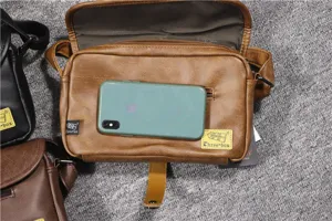 Detailed close-up view of the vintage brown casual crossbody bag with magnetic buckle.