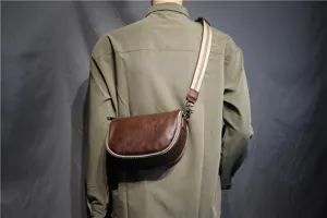 Men retro brown leather saddle bag with striped strap, stylish crossbody shoulder bag for daily use.