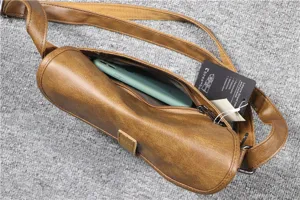 Retro brown PU leather cylinder sling chest bag with zipper and phone pocket detail view.