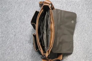 Detailed view of brown leather messenger bag interior, featuring multiple compartments and pockets.