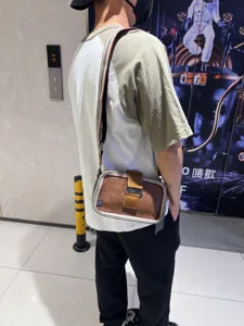 Vintage striped canvas crossbody bag for men and women, casual retro messenger bag with buckle.