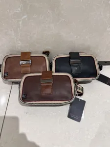 Close-up view of multiple color options for casual crossbody shoulder bags with striped borders.
