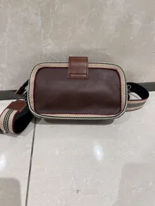 Vintage retro striped leather crossbody bag and stylish shoulder phone bag detail