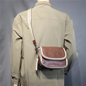 Men's retro brown crossbody messenger bag with striped canvas strap for casual daily use.