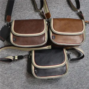 Casual canvas leather cross body shoulder bag for men and women with stylish striped web strap