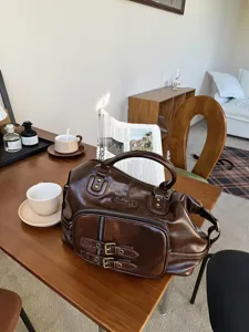 Retro oil wax leather motorcycle style tote bag with multiple carrying ways, vintage brown retro look.