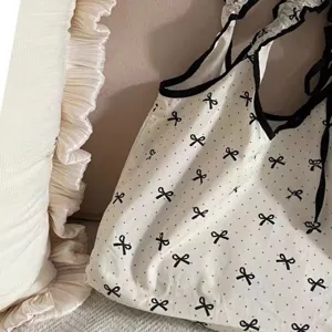Sweet bow polka dot canvas bag aesthetic Korean style drawstring shoulder handbag for commute.