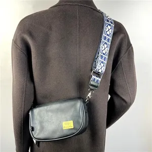 Casual unisex black crossbody shoulder bag with wide patterned strap, daily use.