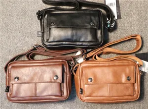 Details of small men shoulder crossbody bag in black and brown, casual design with front pocket.
