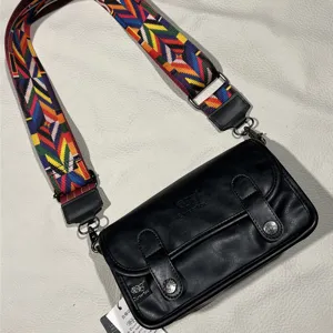 Threebox retro black small crossbody bag with colorful wide strap for daily student use.