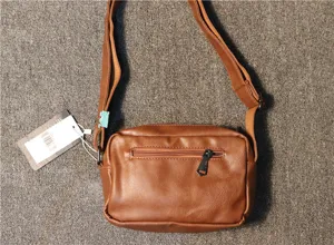 Men casual brown PU leather crossbody bag, stylish small shoulder bag for daily use.