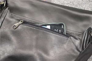 Black PU leather messenger bag detail showing back zipper pocket for daily casual campus use.