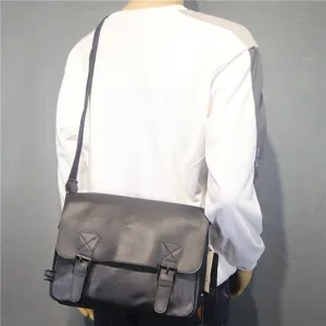 Trendy retro black messenger bag for men and women, casual crossbody school bag.
