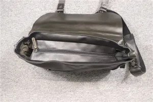 Detail view of mens casual leather messenger bag interior with secure zipper pocket