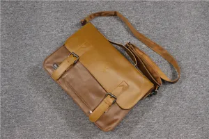 Details view of the vintage brown leather messenger bag with dual buckle flap and adjustable strap.