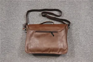 Detailed view of brown men's retro casual messenger bag, featuring shoulder strap and handle.