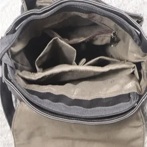 Men's messenger bag interior detail shot, multi-compartment business casual shoulder bag.