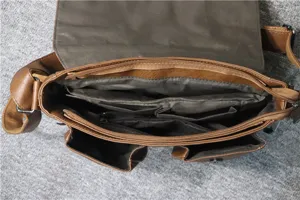 Detailed interior view of a retro brown faux leather messenger bag with multiple zipper pockets.