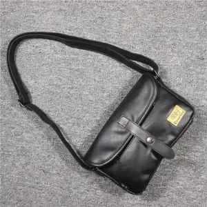 Black PU leather casual crossbody bag for men with adjustable strap and magnetic buckle closure.