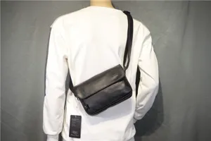 Simple retro black leather messenger bag for men and women, stylish casual crossbody bag.
