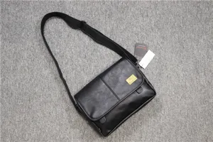 Black leather shoulder bag for men, stylish casual messenger bag with adjustable strap.