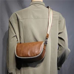 Men's retro brown saddle bag, stylish crossbody shoulder bag with striped strap for daily use.